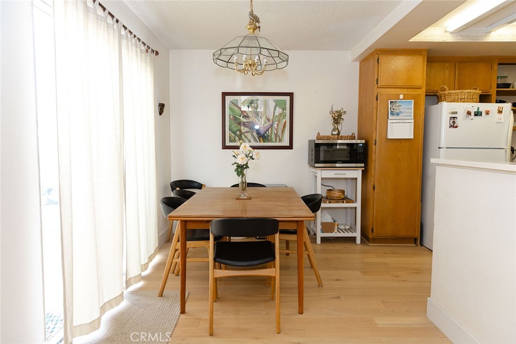 6059 Merion Court Banning, CA 92220 - Photo 23 of 48 a view of a dining room with furniture and window