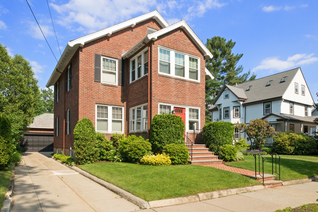 61 Ballard Street Newton, MA 02459 - Photo 1 of 22 a front view of a house with a yard