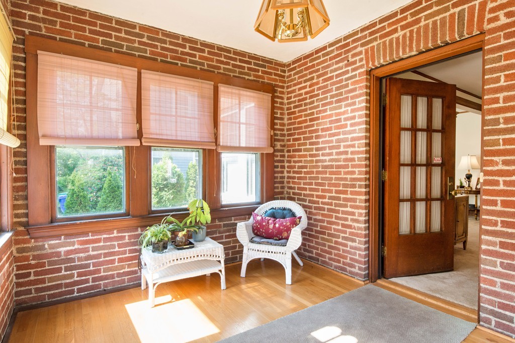 61 Ballard Street Newton, MA 02459 - Photo 2 of 22 a living room with furniture and a large window