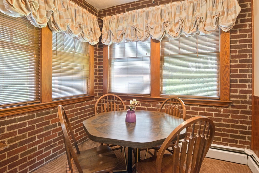 61 Ballard Street Newton, MA 02459 - Photo 10 of 22 a view of a dining room with furniture and windows