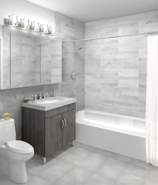 350 West 37th Street, Unit 16C Manhattan, NY 10018 - Photo 5 of 9 a bathroom with a sink vanity mirror bathtub and toilet