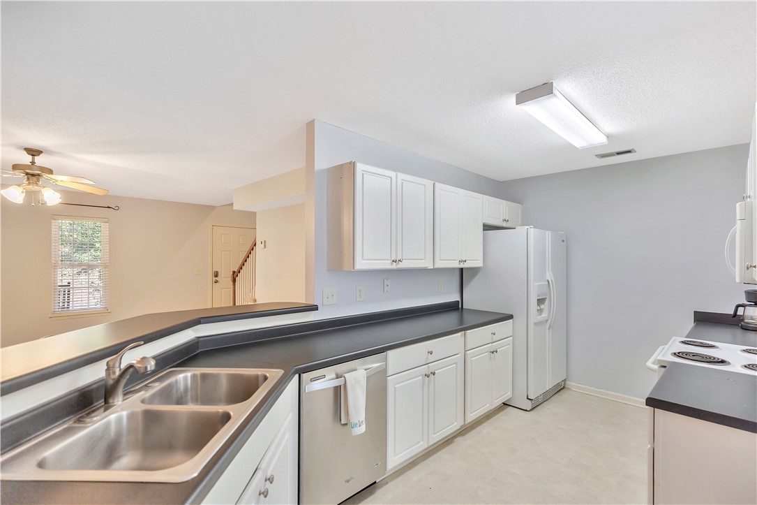 256 Rock Creek Road Clemson, SC 29631 - Photo 13 of 30 This functional kitchen features ample counter space and appliances, with an open view to the living area.