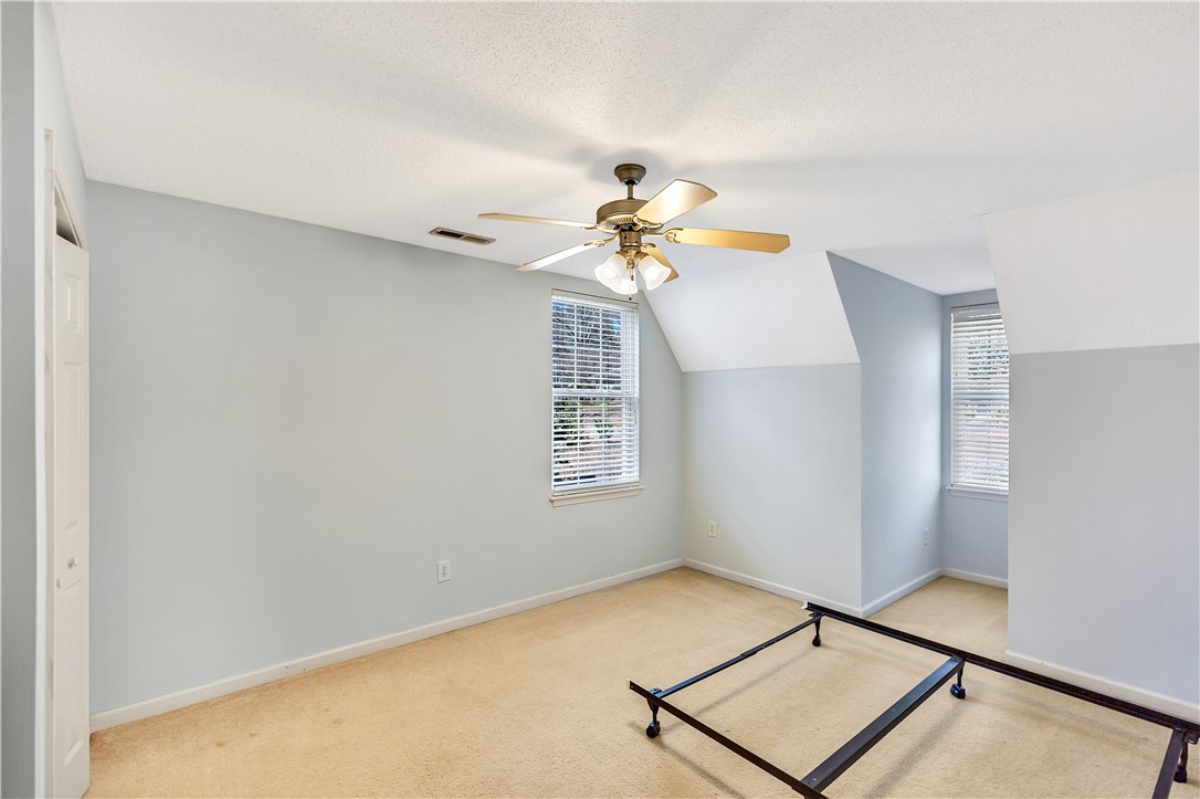 256 Rock Creek Road Clemson, SC 29631 - Photo 26 of 30 This spacious bedroom offers ample natural light and a comfortable atmosphere for rest and relaxation.