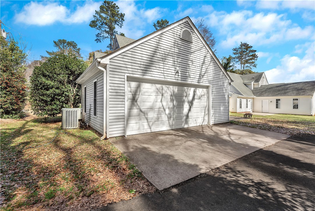 256 Rock Creek Road Clemson, SC 29631 - Photo 28 of 30 This residence features a convenient attached garage and concrete driveway.