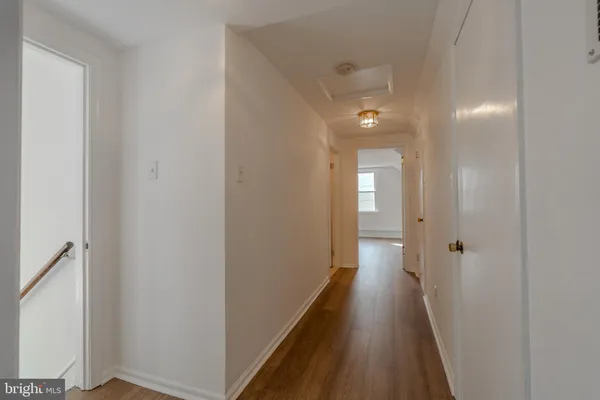 a view of a bathroom from a hallway