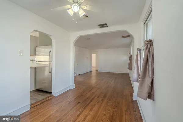 a kitchen with stainless steel appliances white cabinets and a stove