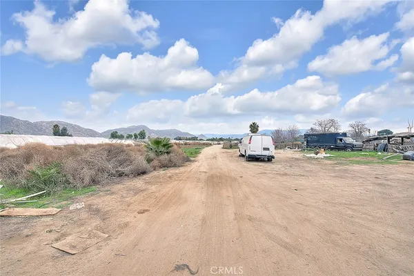 a view of a lake with houses in back