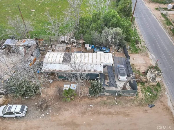 a kitchen with stainless steel appliances granite countertop a refrigerator and a stove