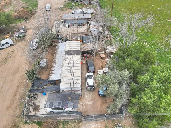 a bedroom with furniture and a chandelier