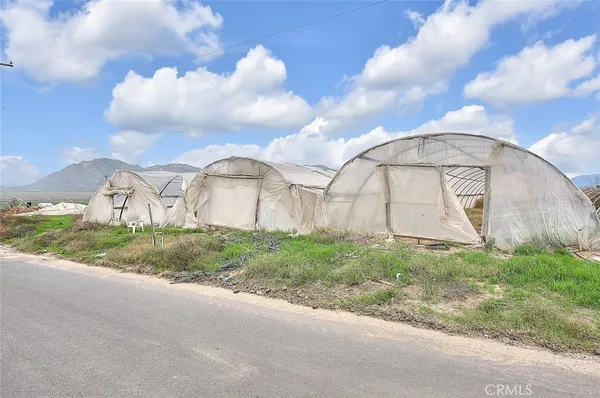 a view of a lake with houses in back