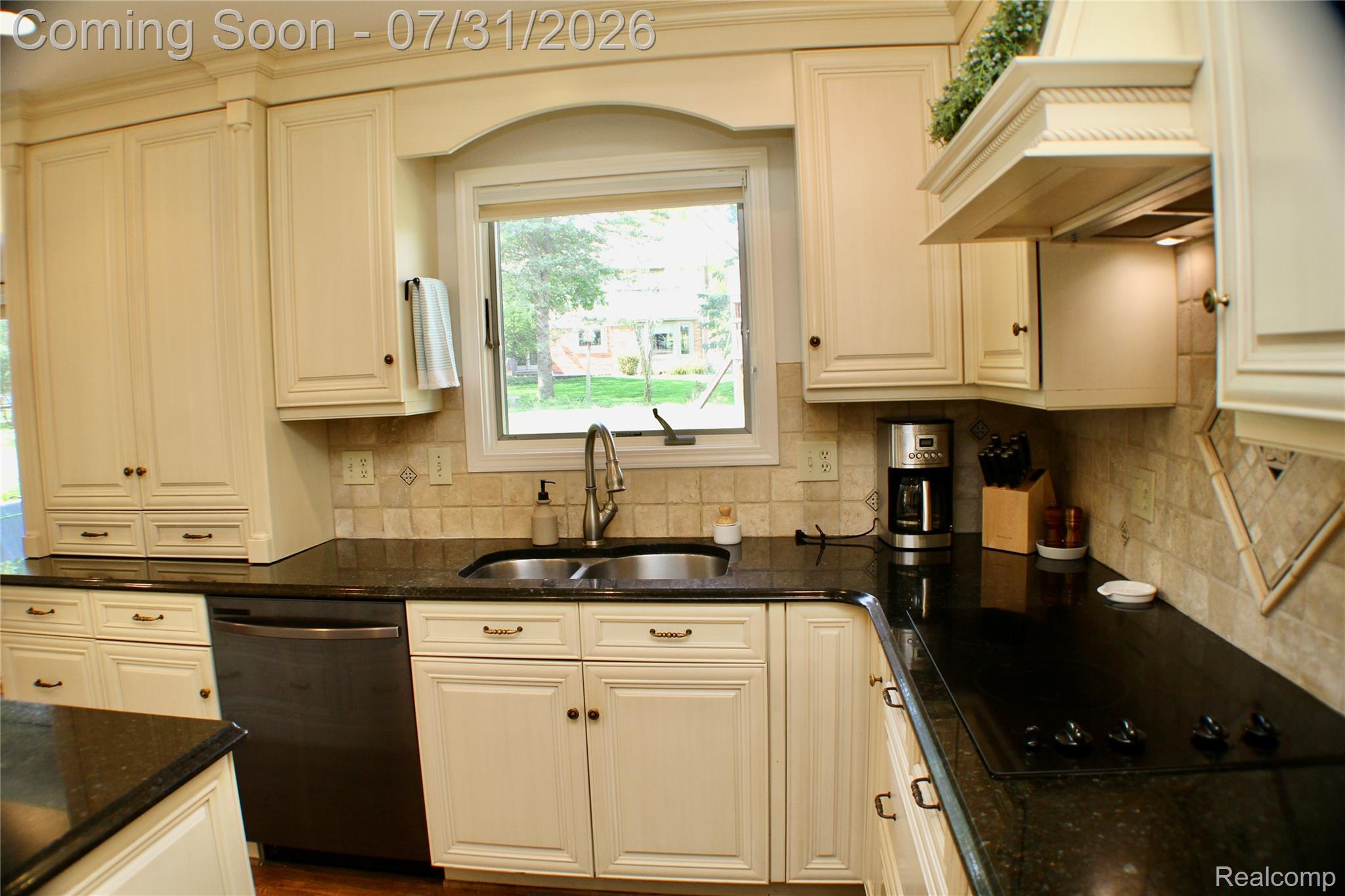 362 Lake Forest Road Rochester, MI 48309 - Photo 21 of 50 Kitchen with cream-finished cabinetry, dark stone countertops, and a tile backsplash