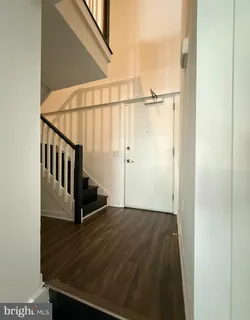 a view of a hallway with staircase
