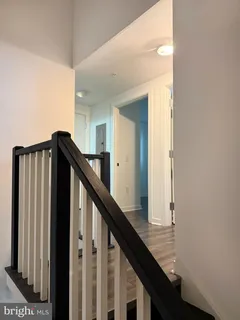 a view of a hallway with staircase