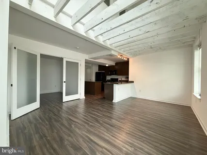 a view of kitchen with cabinets and wooden floor