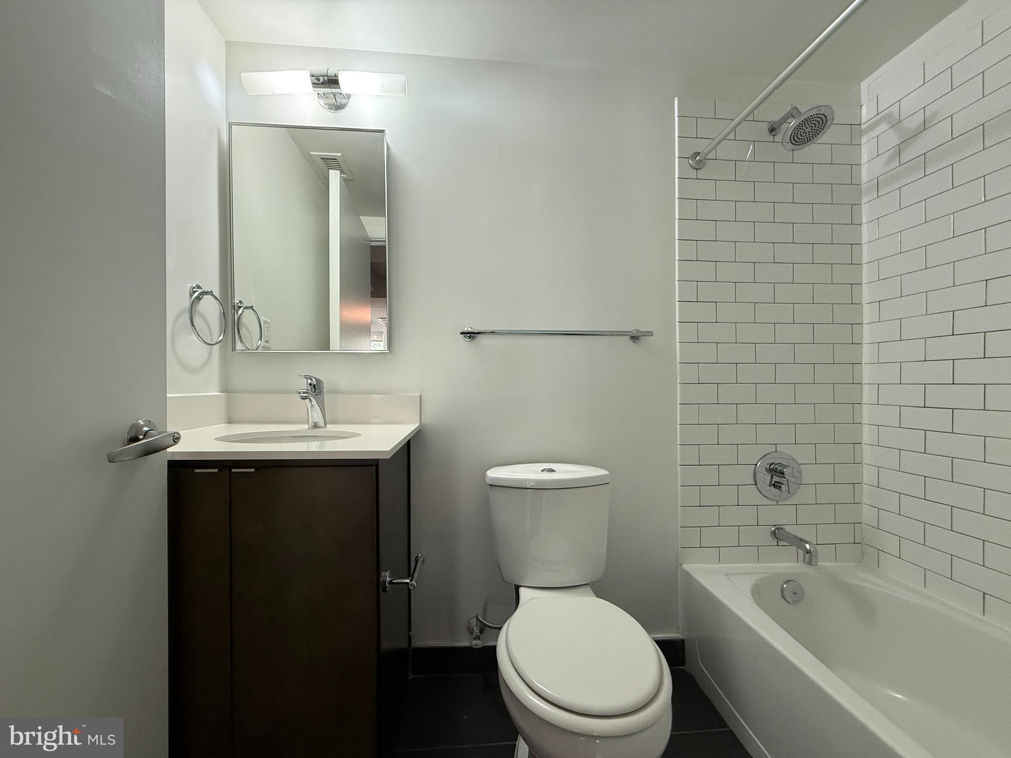 1250 9th Street Northwest, Unit 214 Washington, DC 20001 - Photo 10 of 27 a bathroom with a sink toilet and shower