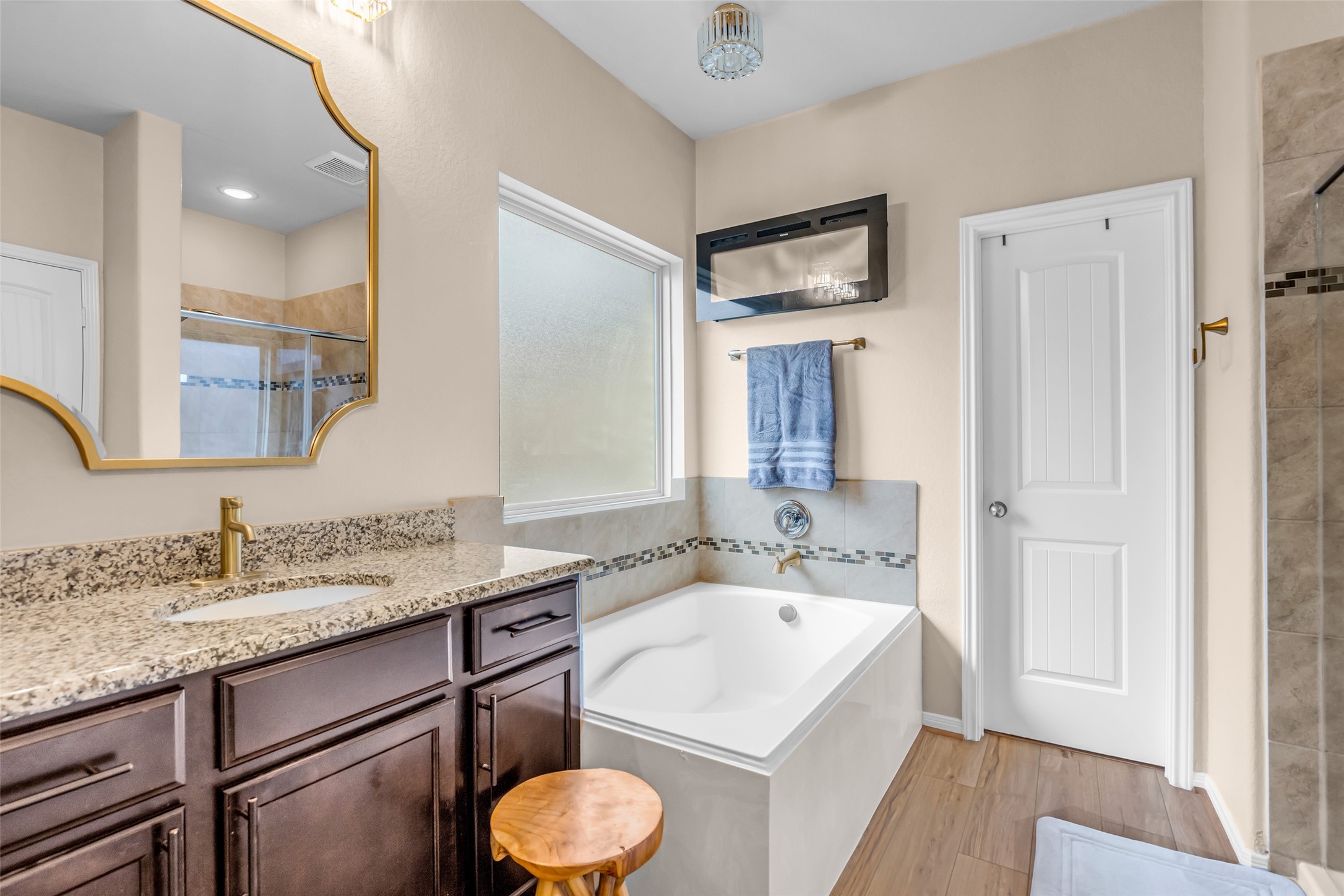 22907 Banff Brook Way Tomball, TX 77375 - Photo 15 of 26 An additional view of the primary bathroom offers a glimpse of the built-in drawers, providing convenient storage while keeping the space neat and organized.