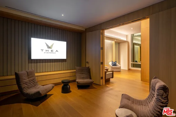 a room with gym equipment and large mirror