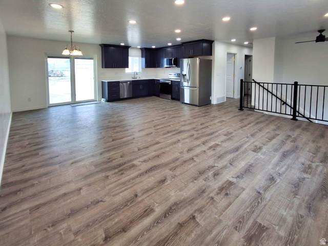 1510 South Lawrence Road Huntington, UT 84528 - Photo 3 of 16 Open-concept living space featuring wood-finish flooring throughout