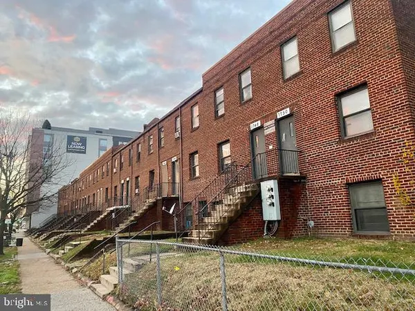 a view of a big house with many windows
