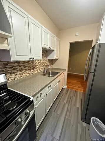a kitchen with a stove and a sink