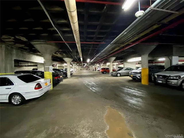 a view of parking garage with cars