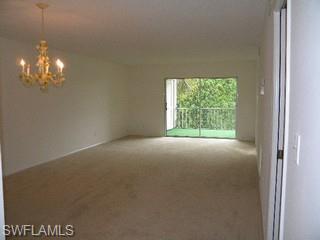 5499 Rattlesnake Hammock Road, Unit 204 Naples, FL 34113 - Photo 3 of 7 a view of empty room with window