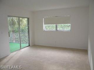 5499 Rattlesnake Hammock Road, Unit 204 Naples, FL 34113 - Photo 5 of 7 an empty room with a window