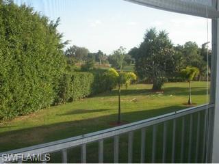 5499 Rattlesnake Hammock Road, Unit 204 Naples, FL 34113 - Photo 6 of 7 a view of a balcony with an outdoor space