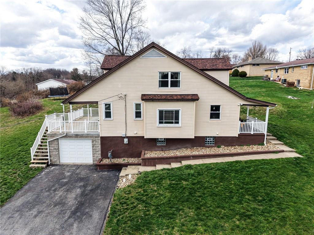 2541 Clay Pike Irwin, PA 15642 - Photo 1 of 36 a front view of a house with a yard