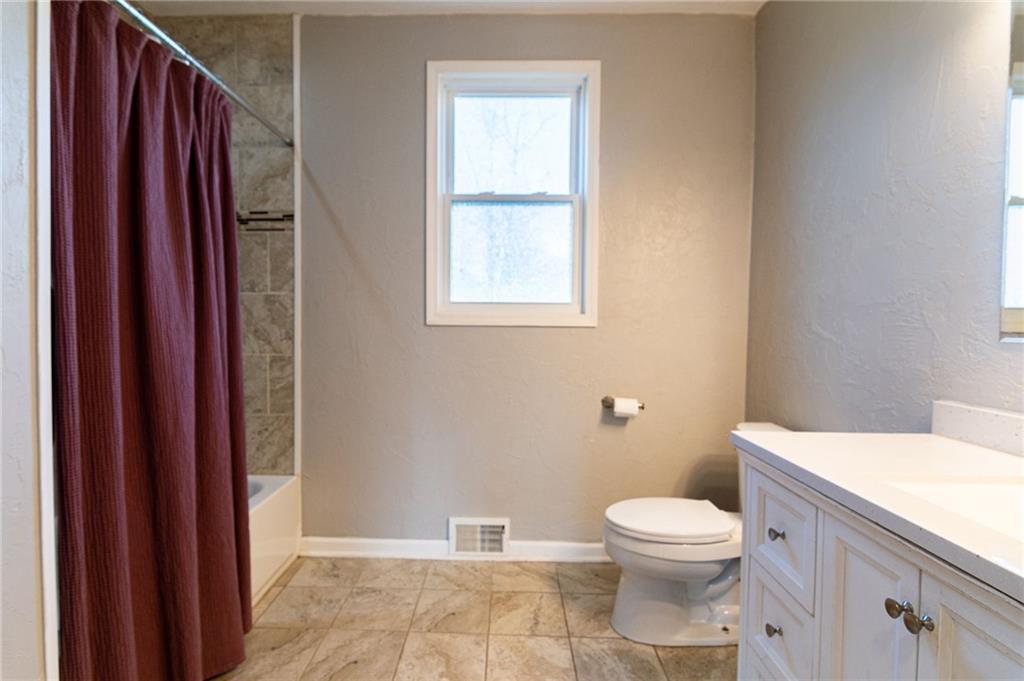 2541 Clay Pike Irwin, PA 15642 - Photo 15 of 36 a bathroom with a toilet a sink and a window