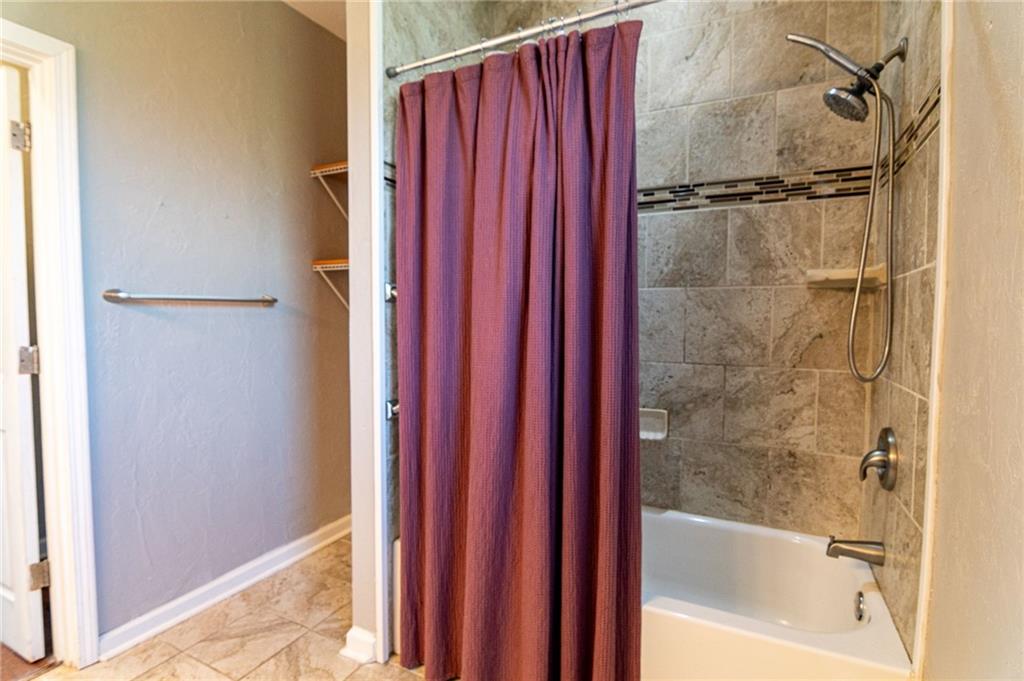 2541 Clay Pike Irwin, PA 15642 - Photo 17 of 36 a bathroom with a bathtub and a shower