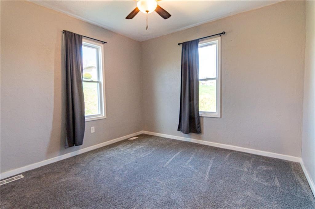 2541 Clay Pike Irwin, PA 15642 - Photo 19 of 36 an empty room with windows and chandelier fan