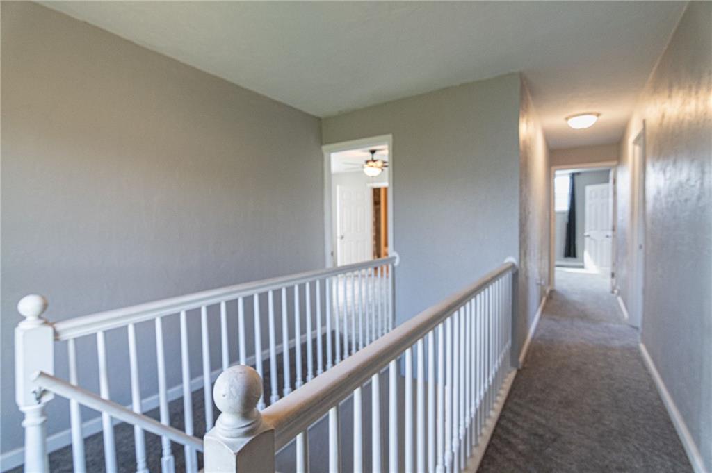 2541 Clay Pike Irwin, PA 15642 - Photo 20 of 36 a view of a hallway with wooden floor and a bathroom