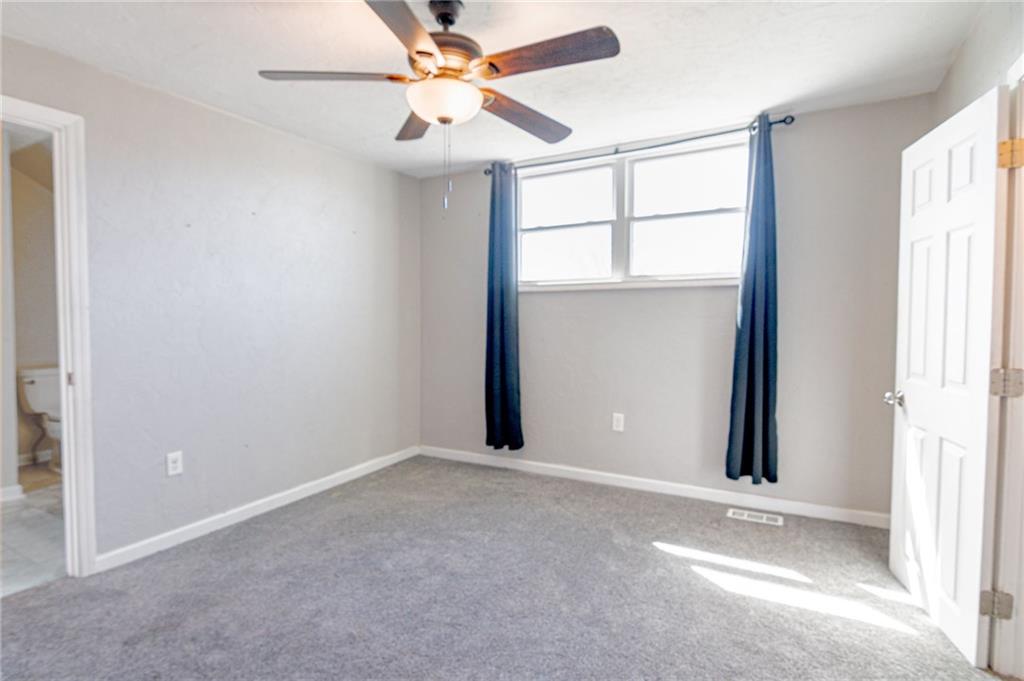 2541 Clay Pike Irwin, PA 15642 - Photo 23 of 36 an empty room with windows and fan