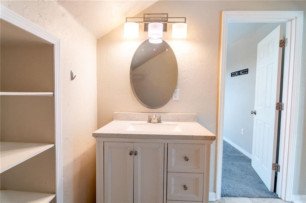 2541 Clay Pike Irwin, PA 15642 - Photo 25 of 36 a bathroom with a sink and a mirror