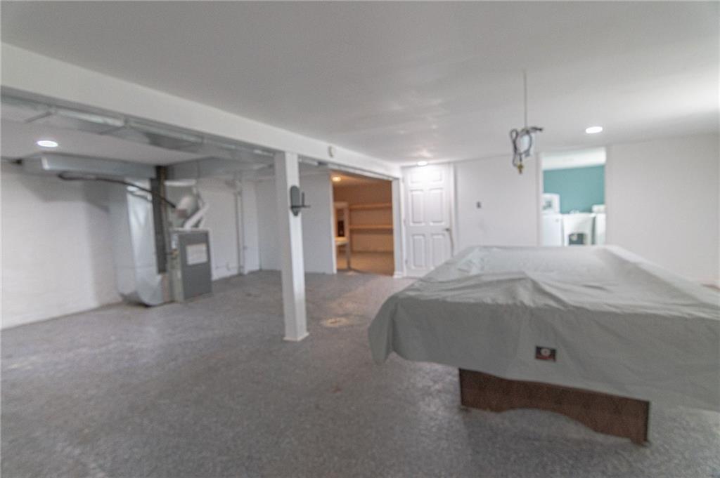 2541 Clay Pike Irwin, PA 15642 - Photo 28 of 36 a spacious bedroom with a bed and a walk in closet
