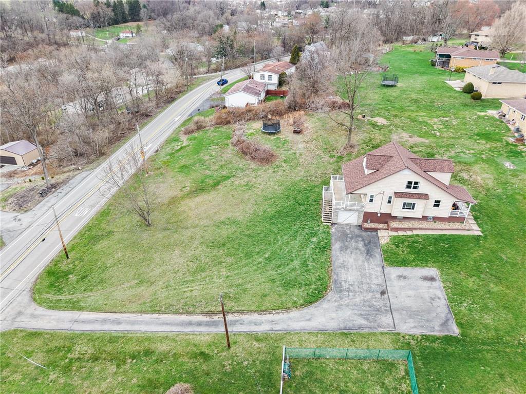 2541 Clay Pike Irwin, PA 15642 - Photo 35 of 36 a aerial view of a house with a yard and lake