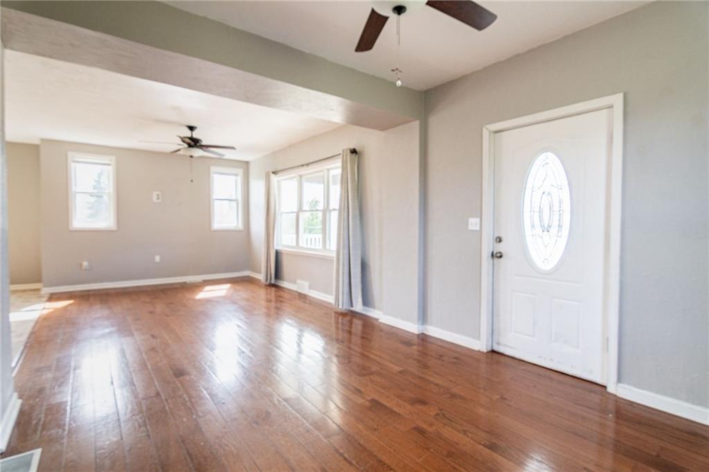2541 Clay Pike Irwin, PA 15642 - Photo 5 of 36 an empty room with wooden floor and windows