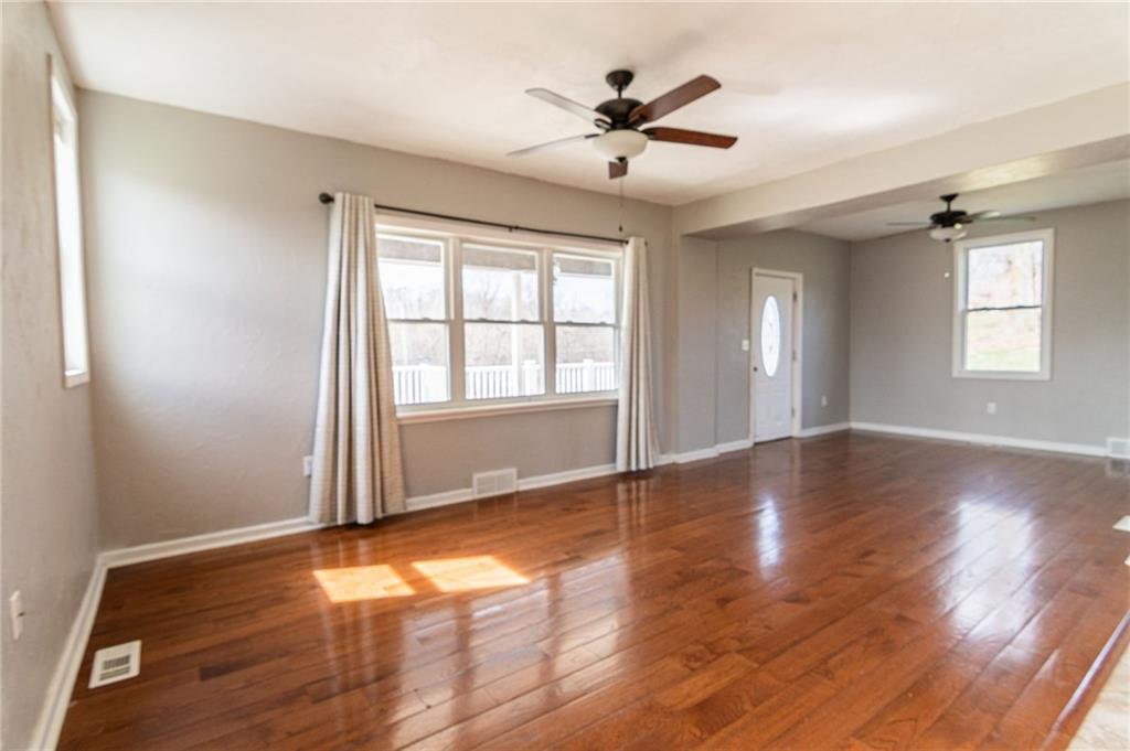 2541 Clay Pike Irwin, PA 15642 - Photo 6 of 36 a view of an empty room with wooden floor and a window