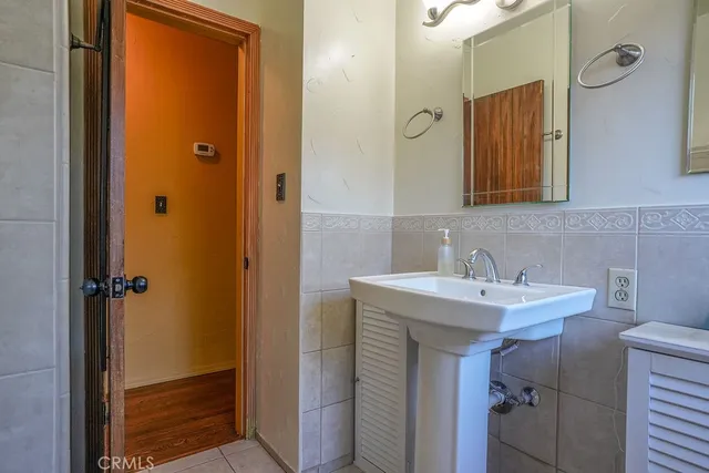 a bathroom with a sink a toilet and bathtub
