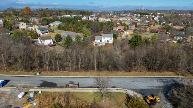 an aerial view of a house with a swimming pool