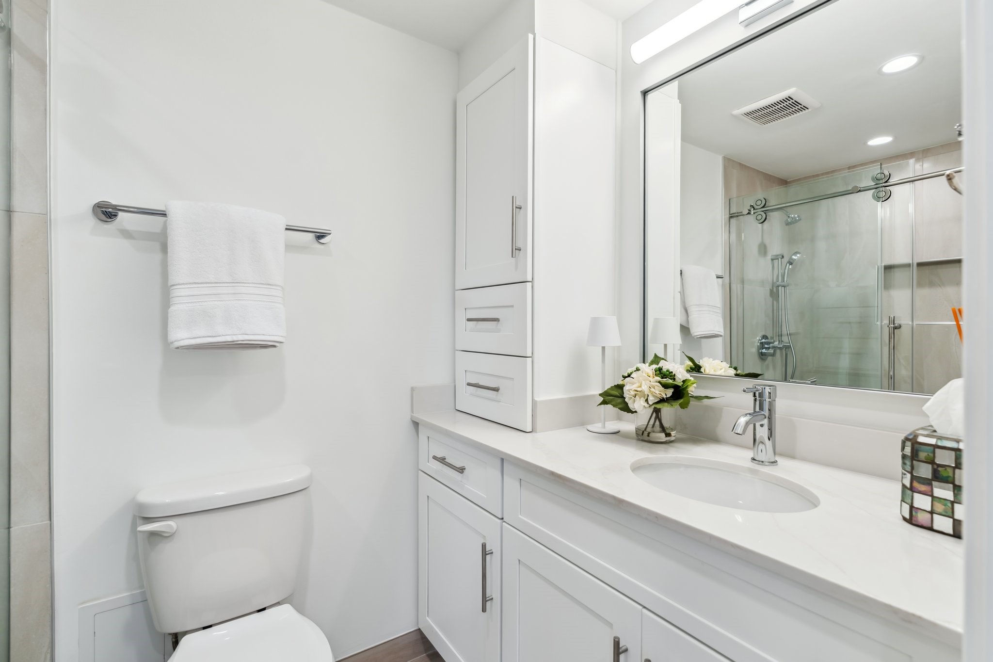 2001 Holcombe Boulevard, Unit 2305 Houston, TX 77030 - Photo 16 of 46 a bathroom with a sink a toilet and shower