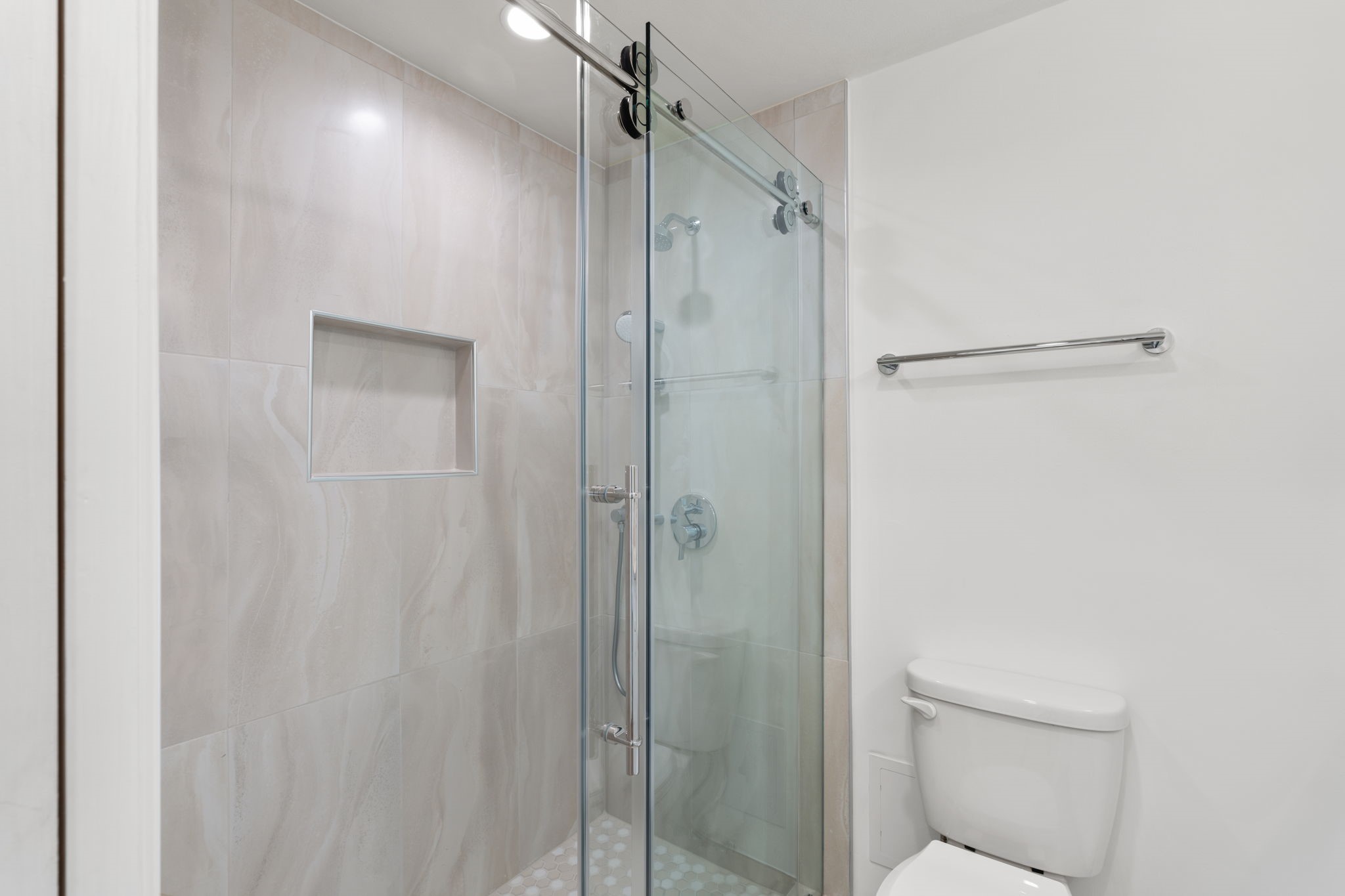 2001 Holcombe Boulevard, Unit 2305 Houston, TX 77030 - Photo 17 of 46 a bathroom with a shower and a glass door