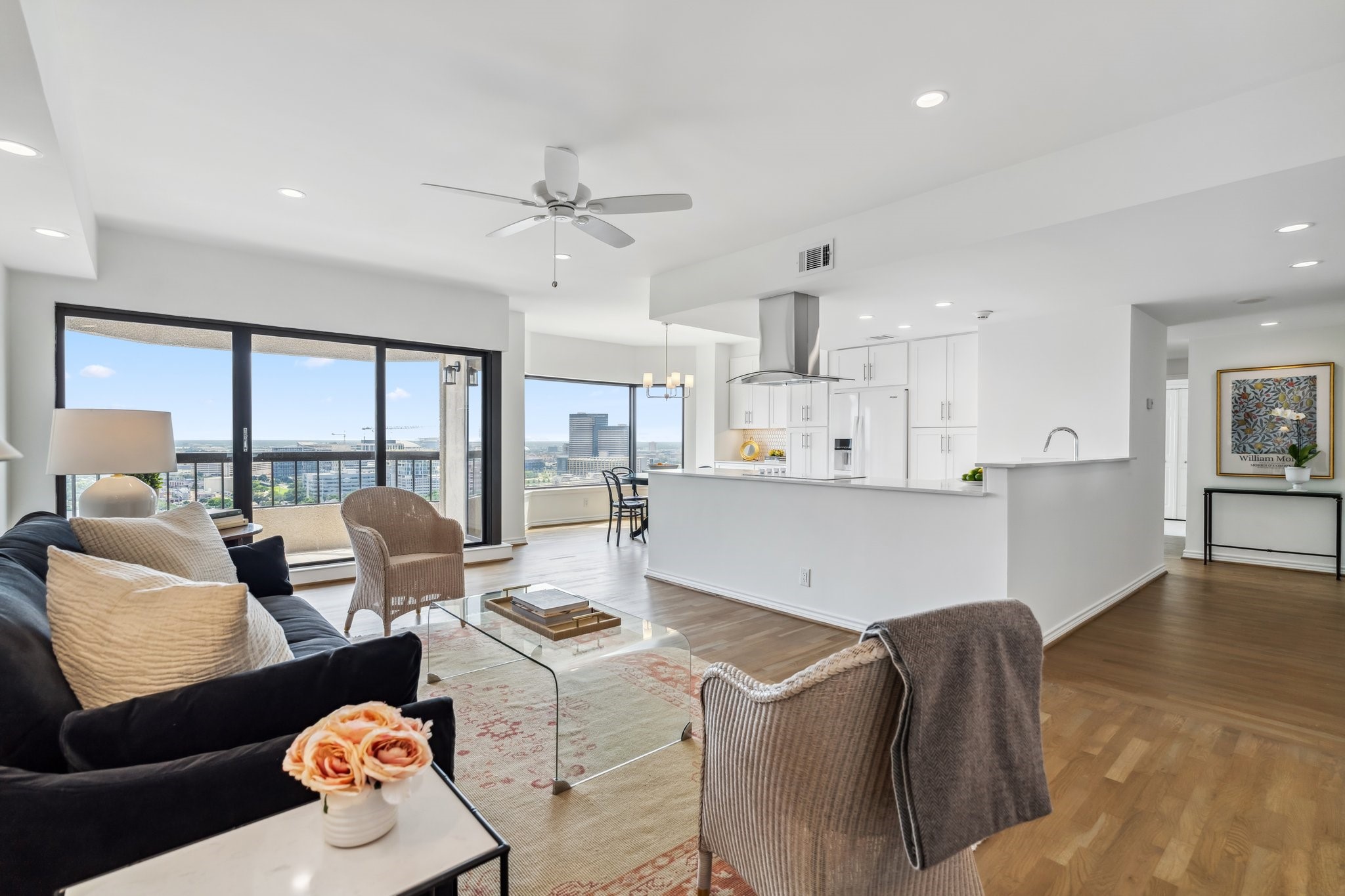 2001 Holcombe Boulevard, Unit 2305 Houston, TX 77030 - Photo 3 of 46 a living room with couches and kitchen view with wooden floor