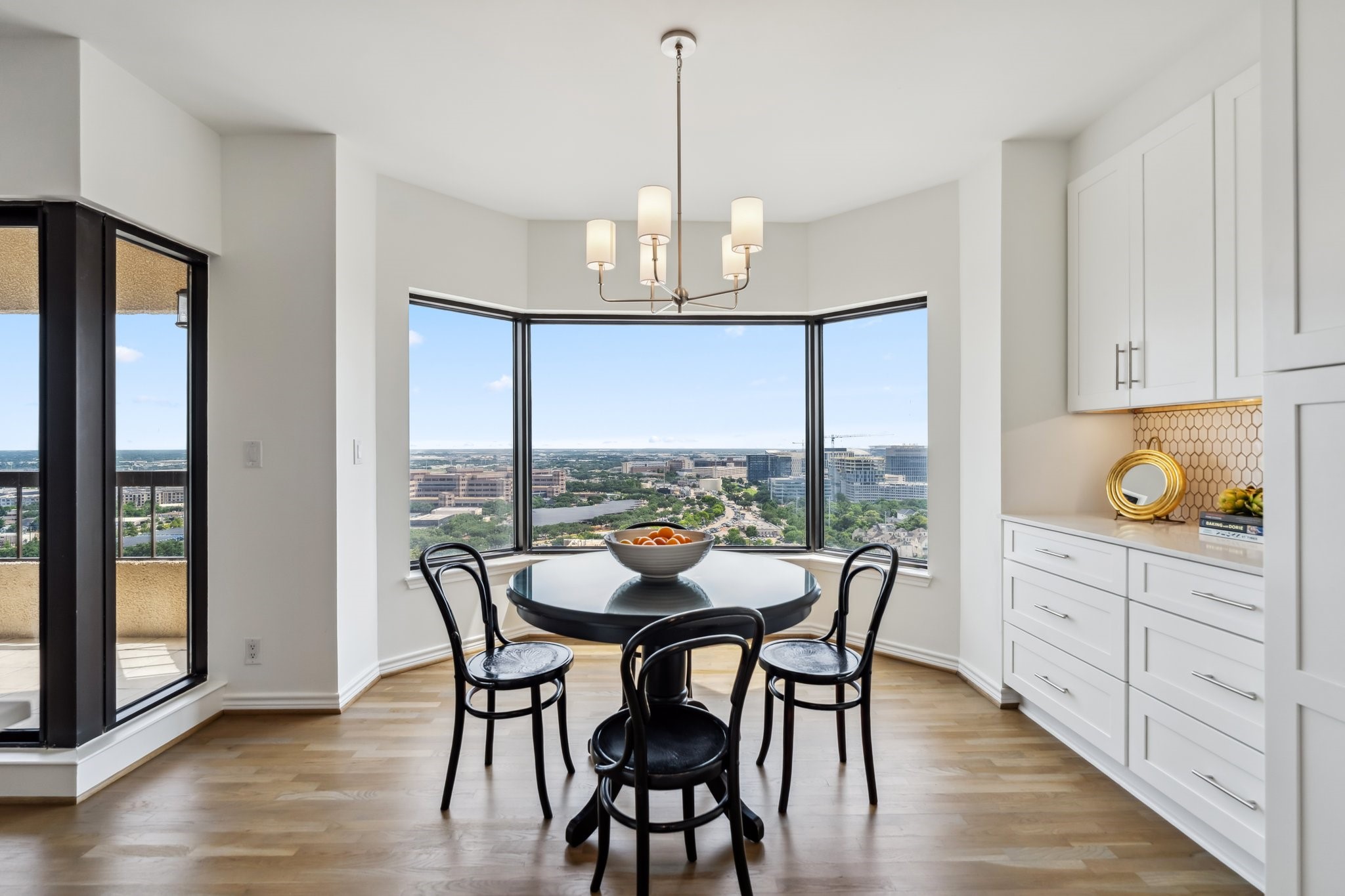 2001 Holcombe Boulevard, Unit 2305 Houston, TX 77030 - Photo 5 of 46 a dining room with furniture a chandelier and wooden floor