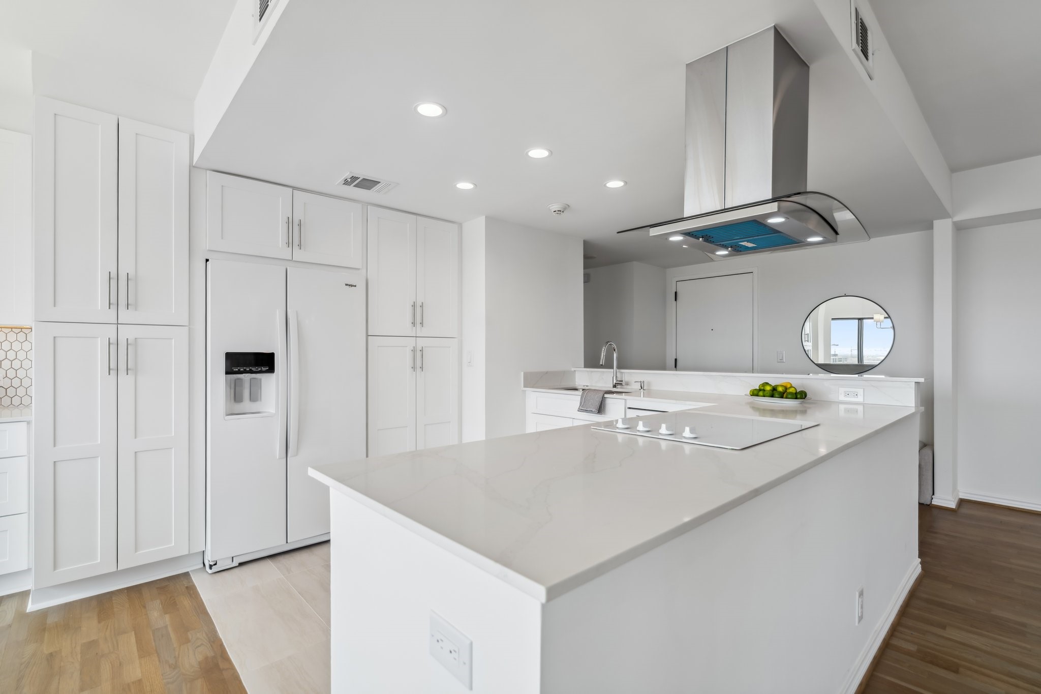 2001 Holcombe Boulevard, Unit 2305 Houston, TX 77030 - Photo 7 of 46 a kitchen with kitchen island a stove and a refrigerator