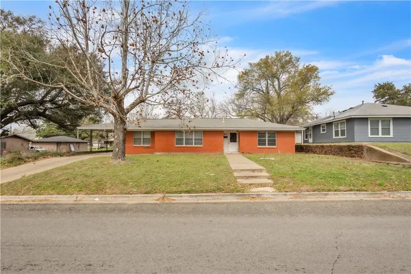 front view of a house with a yard
