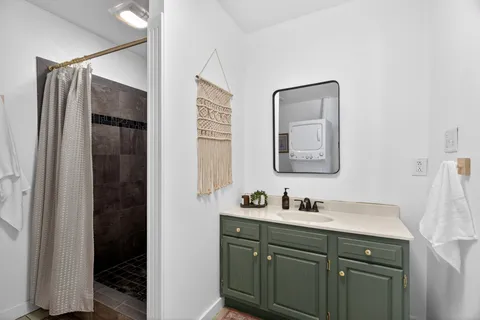 a bathroom with a double vanity sink and mirror