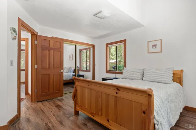 a room with a bed and a dresser