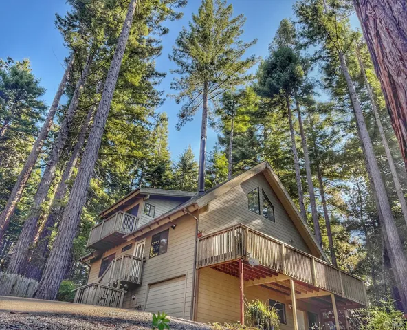 a view of a house with a tree